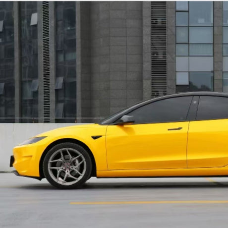 A bright yellow sports car with Amber Yellow Glossy SelfRepair Nano-Coated PPF is parked in front of a modern glass and concrete building.