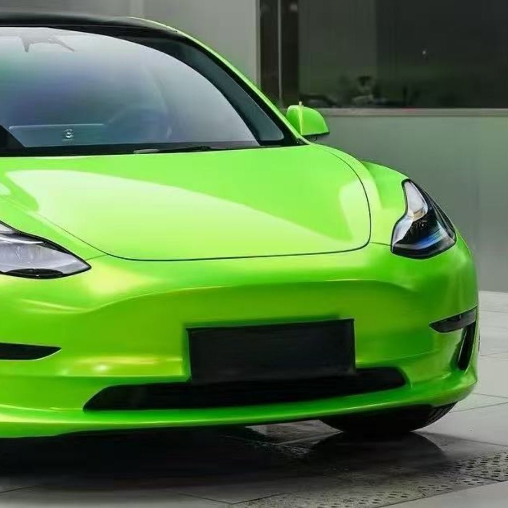 A Gold Green Charm SelfRepair Nano-Coated PPF sports car is parked on tiles, highlighting its sleek front, headlights, and windshield. The modern look is enhanced by the protective nano-coated film.