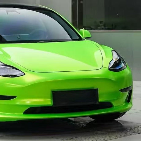 A Gold Green Charm SelfRepair Nano-Coated PPF sports car is parked on tiles, highlighting its sleek front, headlights, and windshield. The modern look is enhanced by the protective nano-coated film.