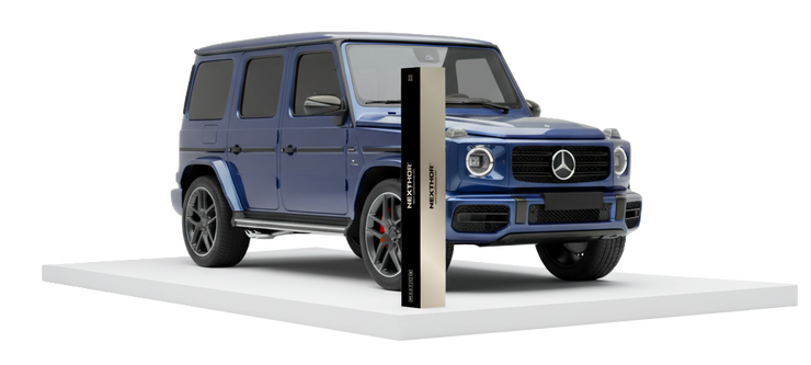 A blue Mercedes-Benz G-Class SUV displayed on a white platform, with a vertical rectangular sign in front of it, against a plain white background.