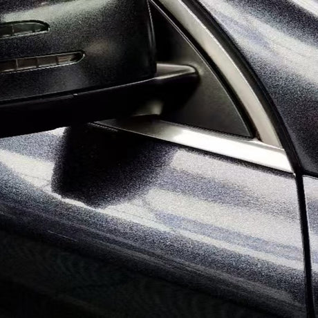 A close-up of a metallic gray car’s side mirror and door shows reflections on the shiny surface, protected by Midnight Black Sparkle Glossy SelfRepair Nano-Coated PPF.