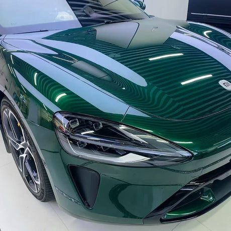 A green car with its hood open, featuring Agate Green Liquid Metallic Glossy SelfRepair Nano-Coated PPF for a sleek, protective finish.