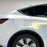 Close-up of a white car’s rear, showcasing its modern design protected by White Diamond Gold Glossy SelfRepair Nano-Coated PPF for superior shine and durability. The reflective finish highlights the vehicle’s refined style.