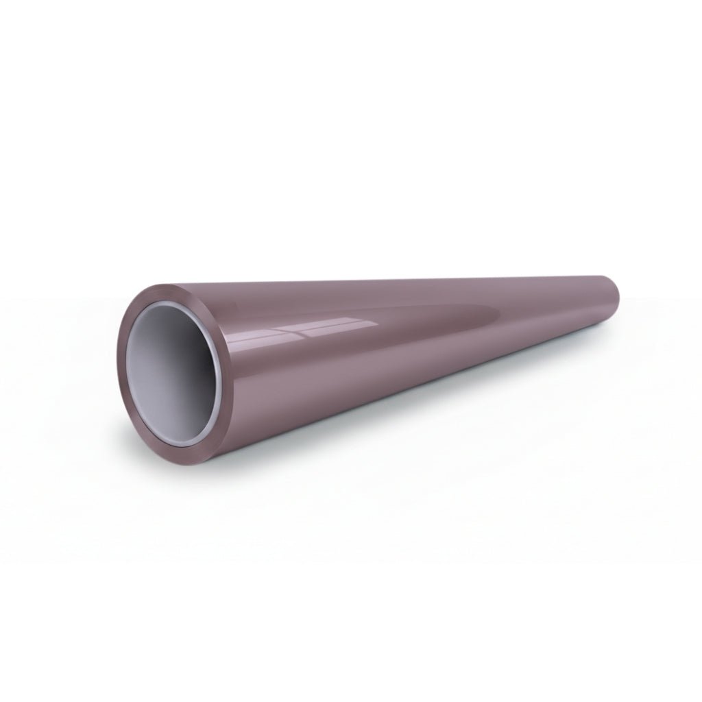 A shiny, brown, hollow cylindrical pipe with a white inner lining—possibly protected by Ice Berry Pink Liquid Metallic Glossy SelfRepair Nano-Coated PPF—rests on a white surface, viewed from an angled perspective.