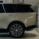 A car gleams in the showroom under the lights, protected by Batumi Gold Liquid Metallic Glossy SelfRepair Nano-Coated PPF for a flawless finish and unmatched durability.