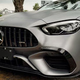 Close-up of the front end of a silver Mercedes-AMG with AMG badge, headlight, and bumper. Palm tree reflections appear on the hood, protected by AMG Mountain Gray Matte SelfRepair Nano-Coated PPF.