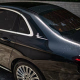 A close-up of a luxury car’s rear with tinted windows, chrome trim, stylish alloys, and sunlight reflecting off the Midnight Black Sparkle Glossy SelfRepair Nano-Coated PPF.