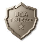 A metallic badge shaped like a shield reads USA TPU BASE with a star beneath the text, all embossed on the surface.
