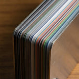 A close-up of the Nexthor PPF Sample Kit (All Colors) shows neatly aligned, colorful plastic cards with visible metal edges, resting on a wooden surface.