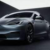 A sleek metallic gray electric car finished in Satin Titanium Ice Matte is parked in a minimalist setting. Its surface is protected by Satin Titanium Ice SelfRepair Nano-Coated PPF with advanced self-healing technology.